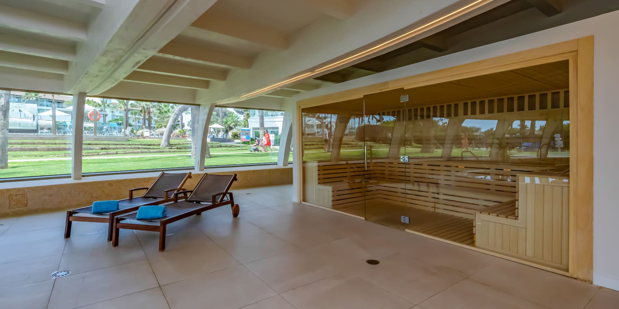 a room with a sauna and chairs
