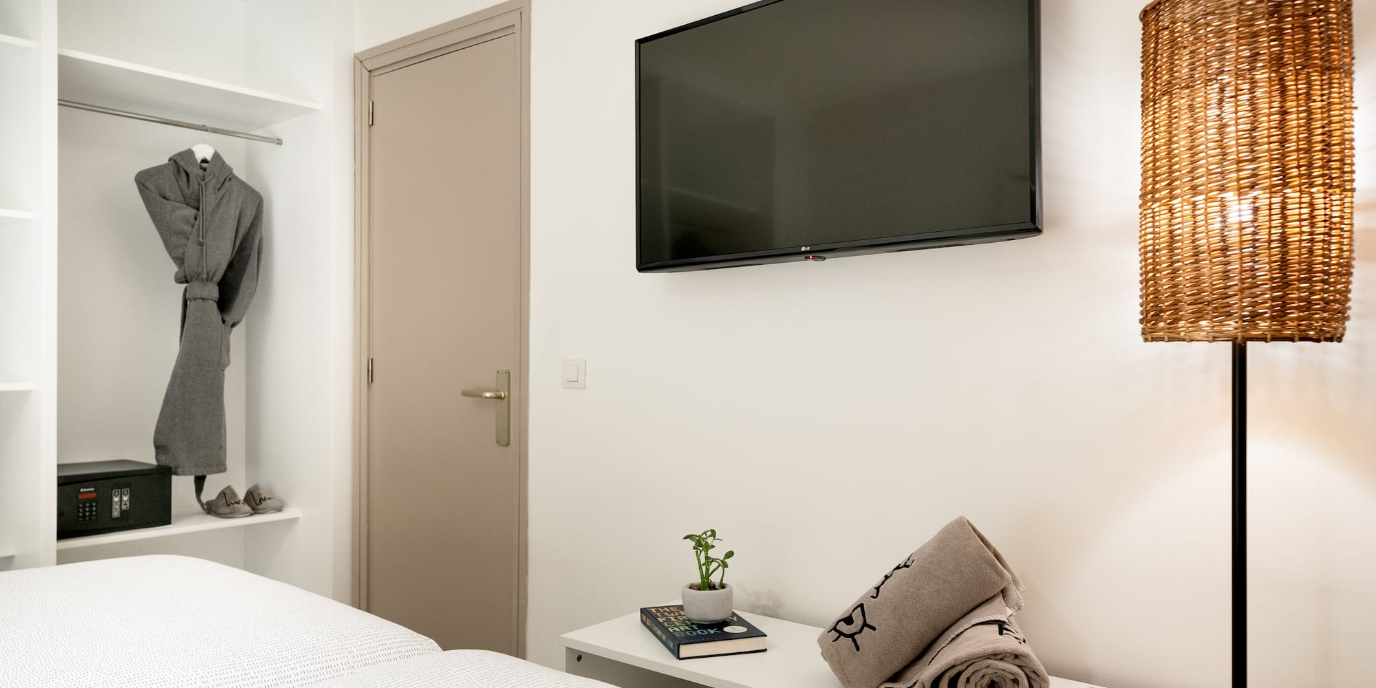 a room with a tv and a bed