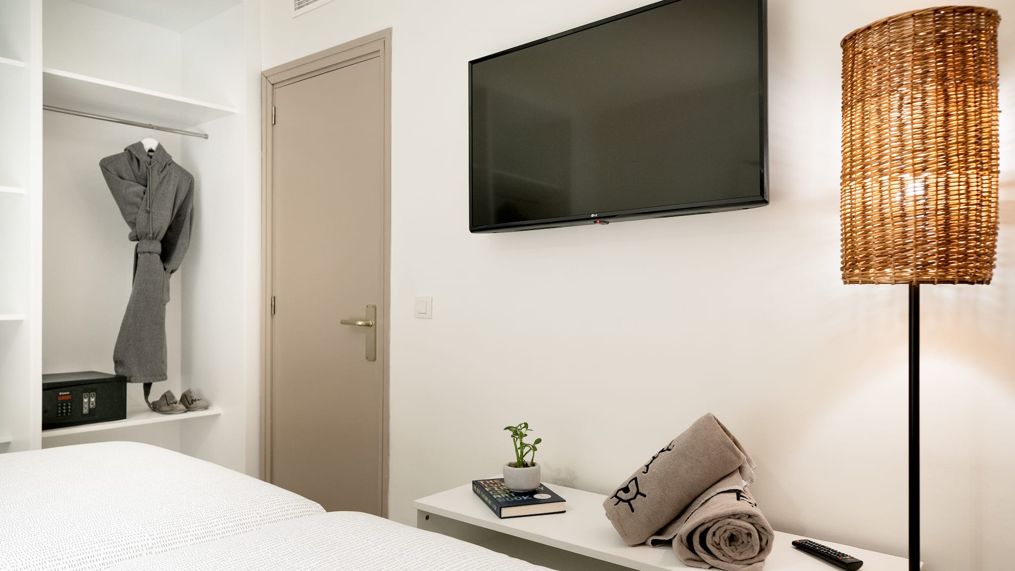 a room with a tv and a bed