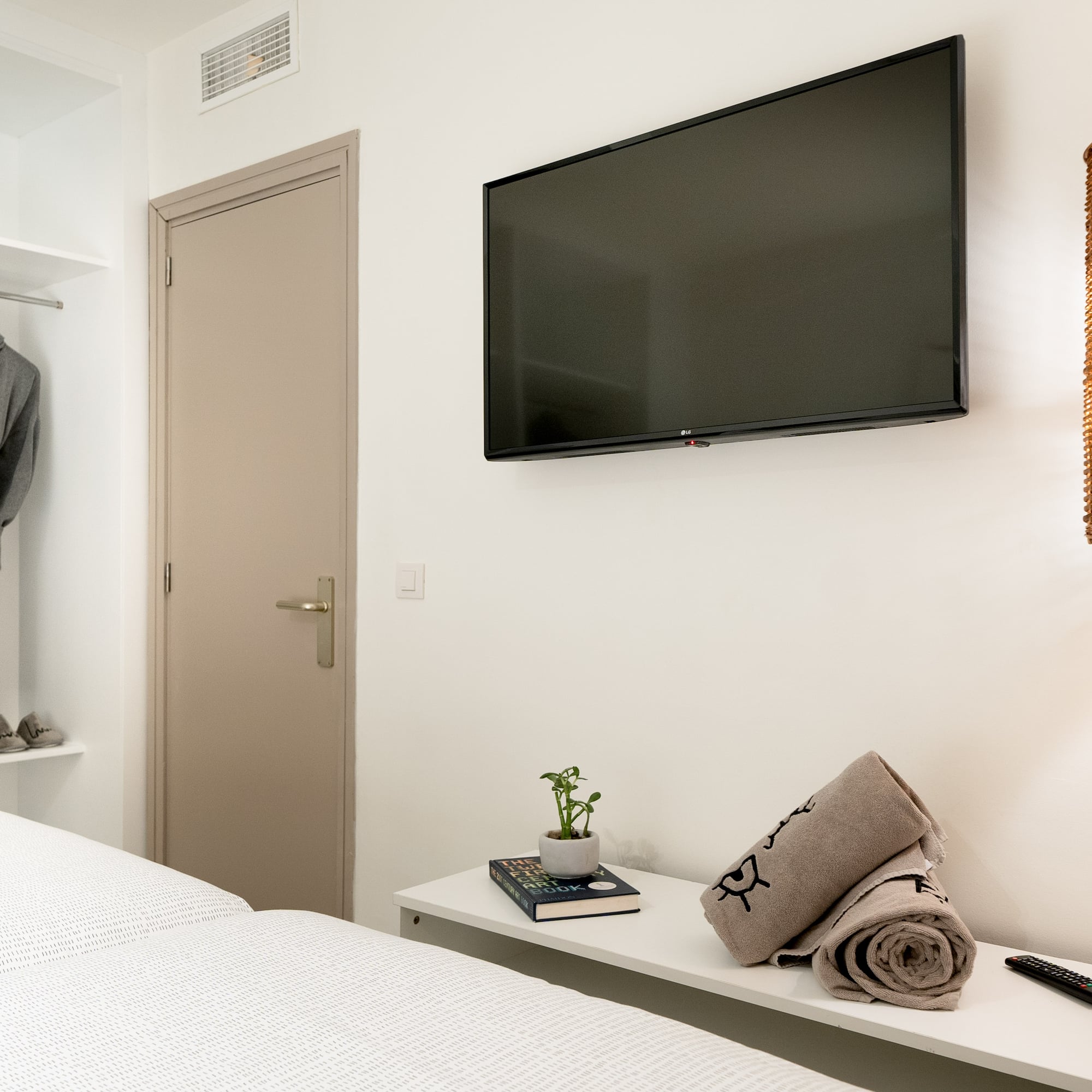 a room with a tv and a bed