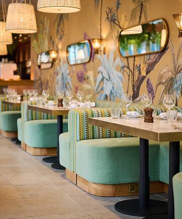 a restaurant with tables and chairs