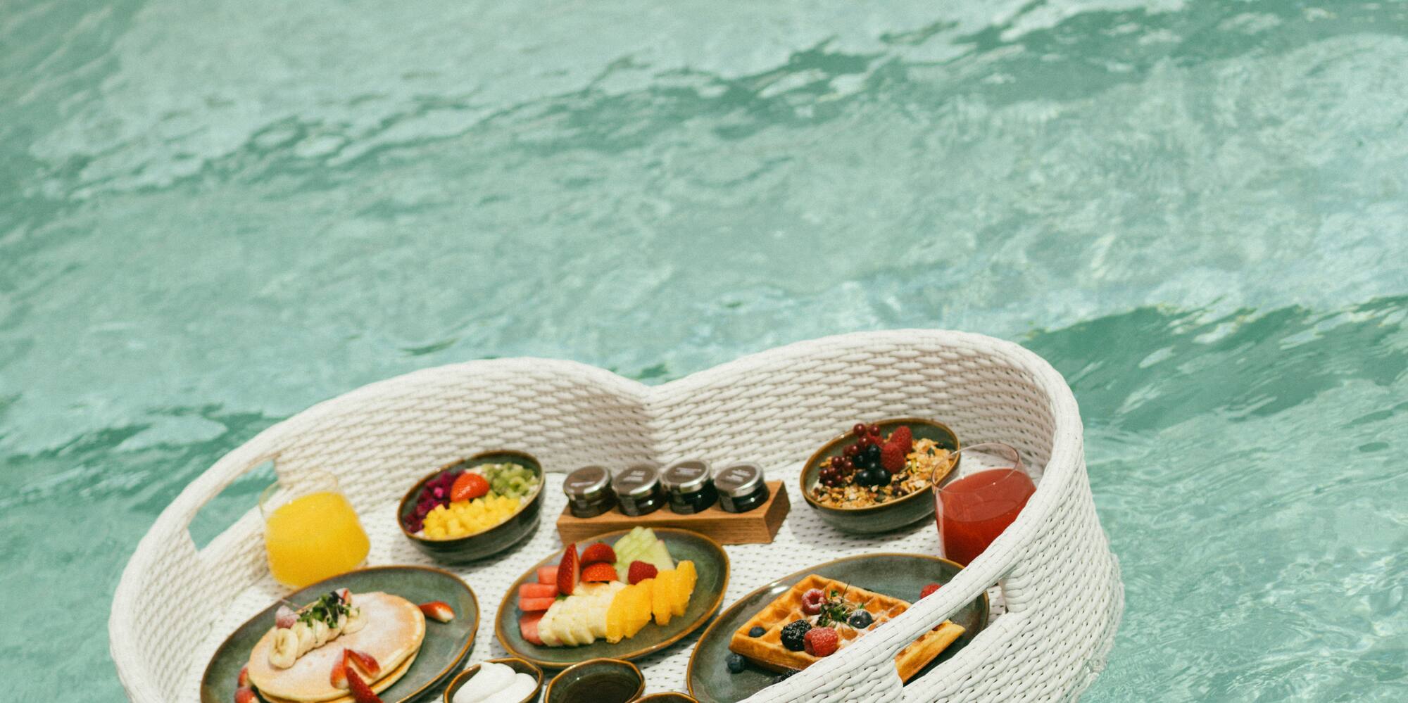 a basket of food floating in water