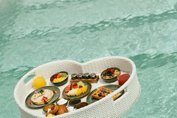 a basket of food floating in water