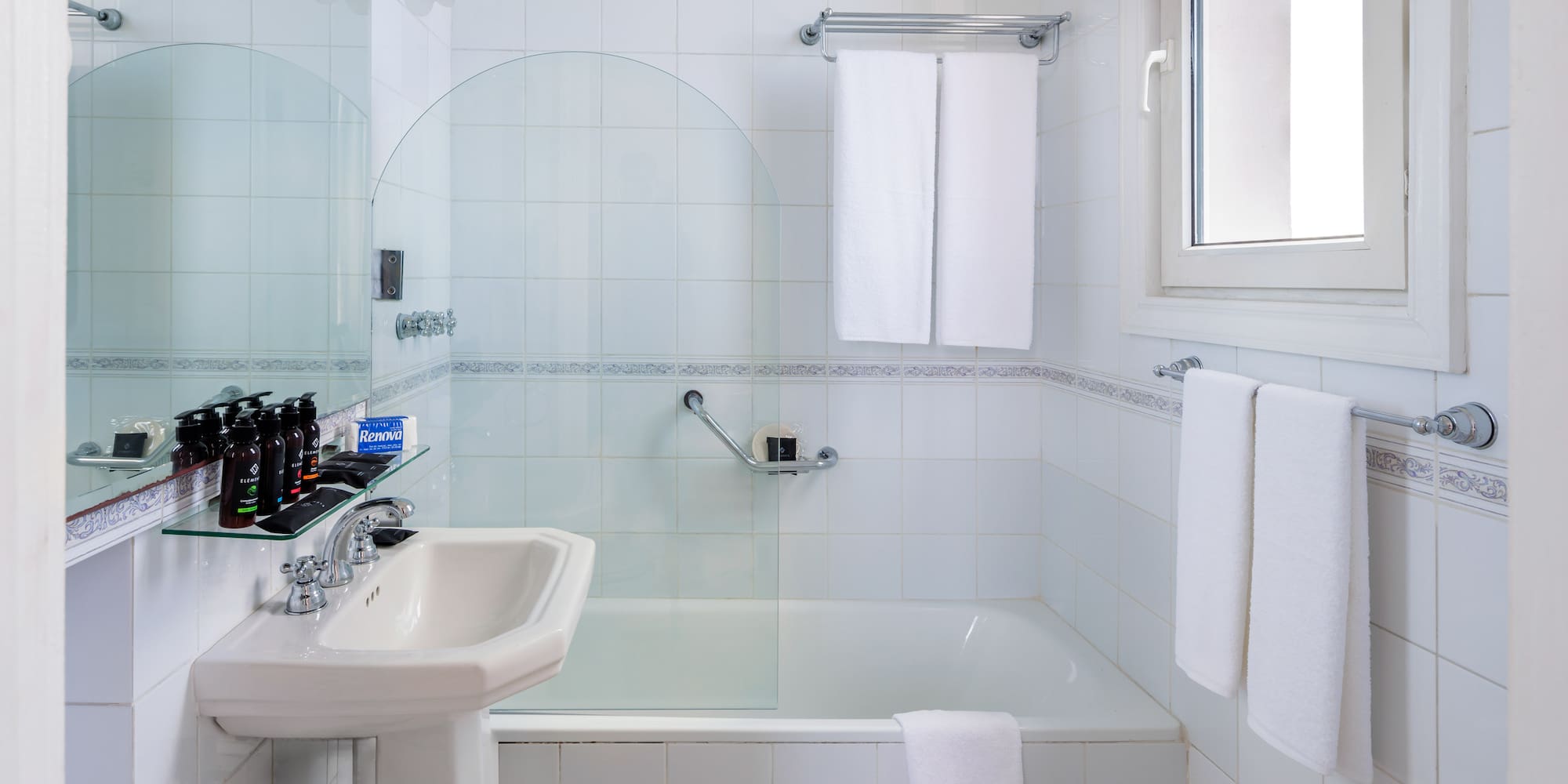 a bathroom with a sink and shower