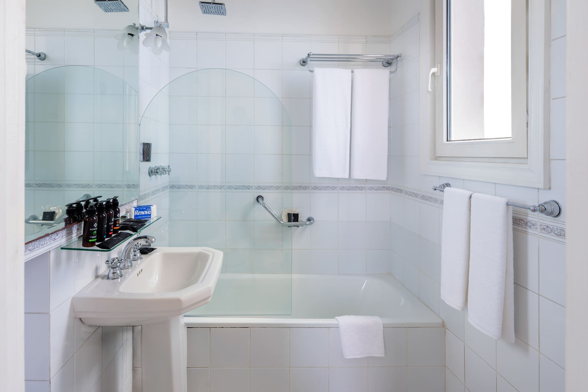 a bathroom with a sink and shower