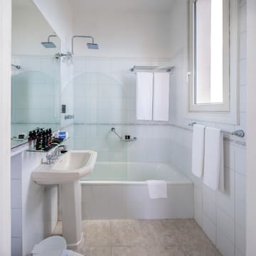 a bathroom with a sink and shower