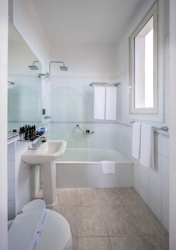 a bathroom with a sink and shower
