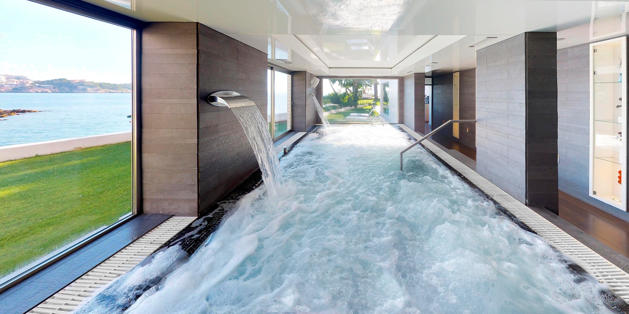 a hot tub with water falling out of it