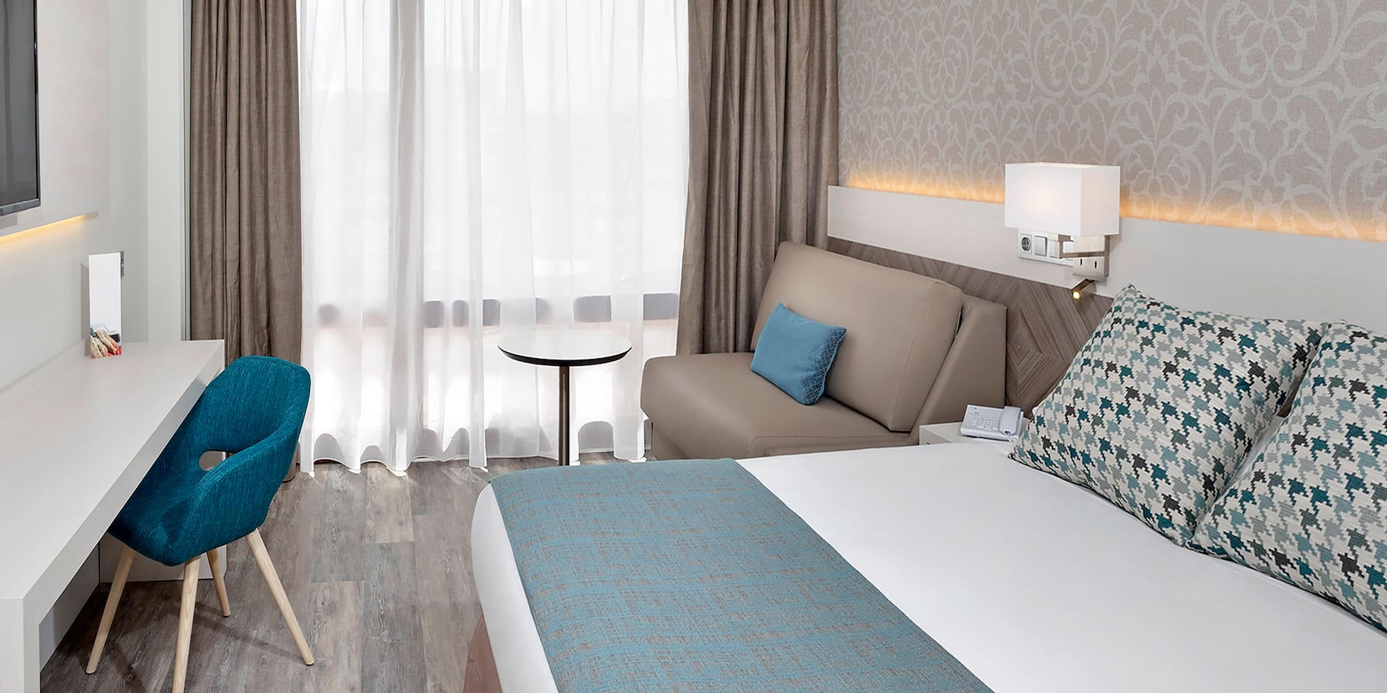 a room with a bed and a chair