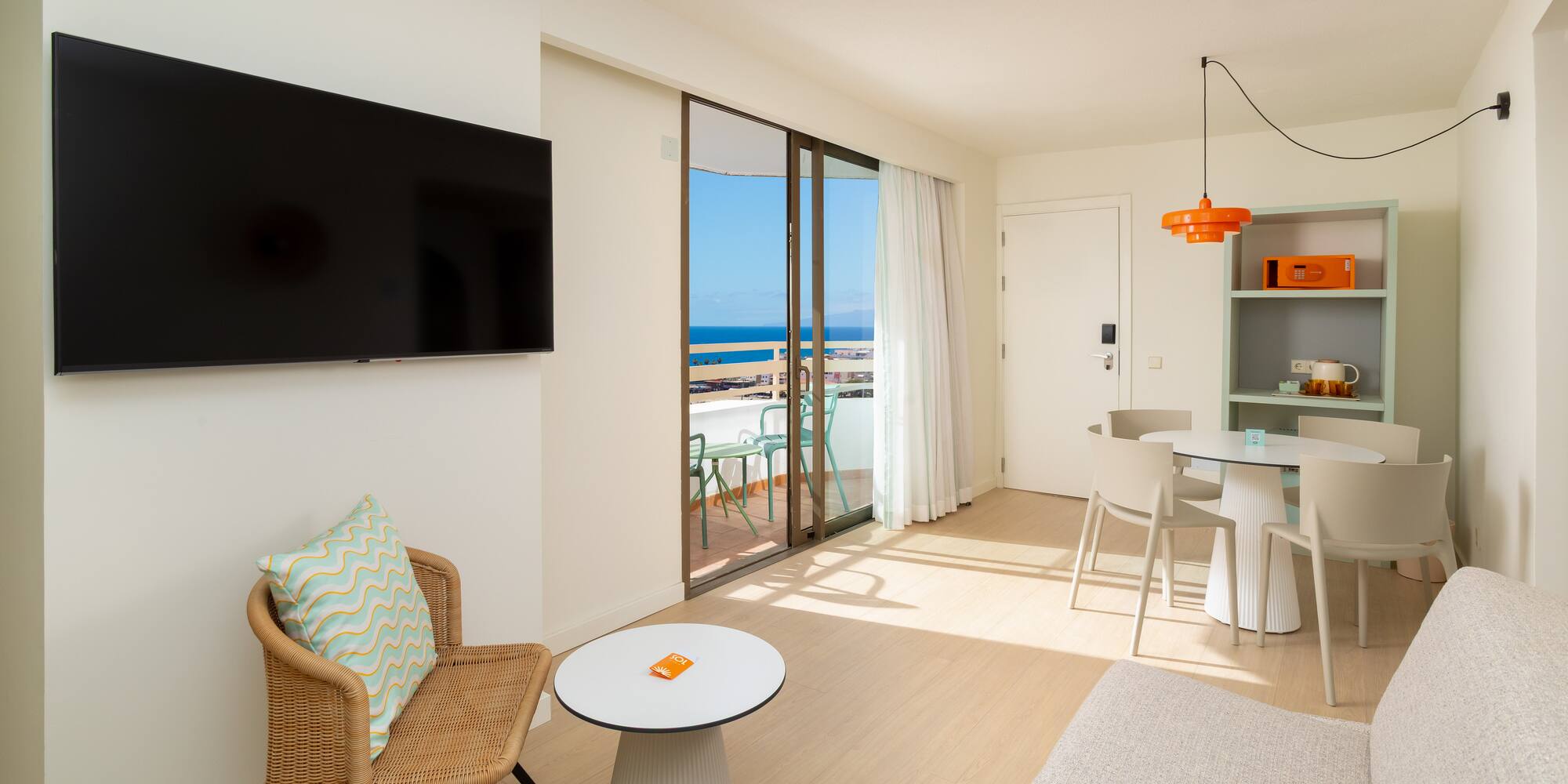 a living room with a television and a table