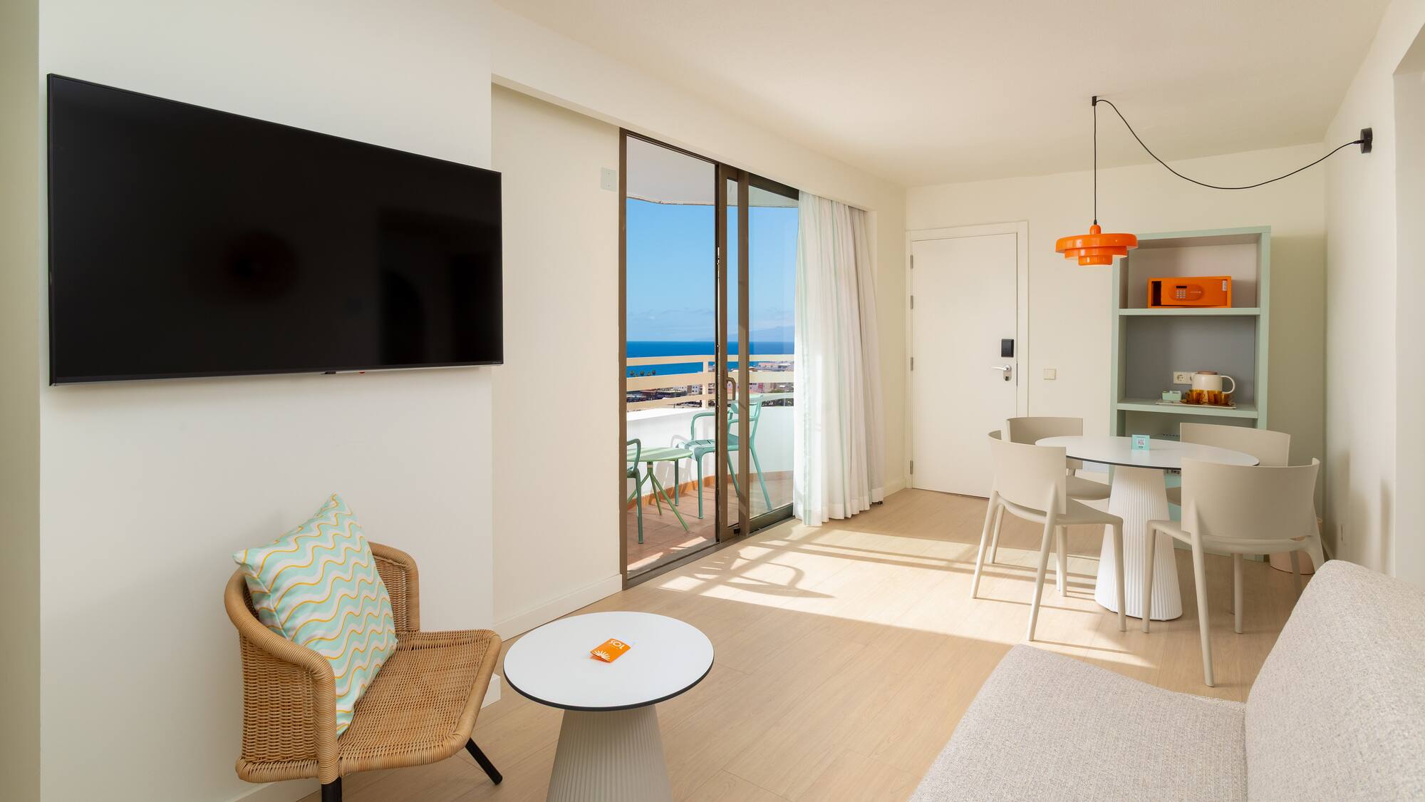 a living room with a television and a table