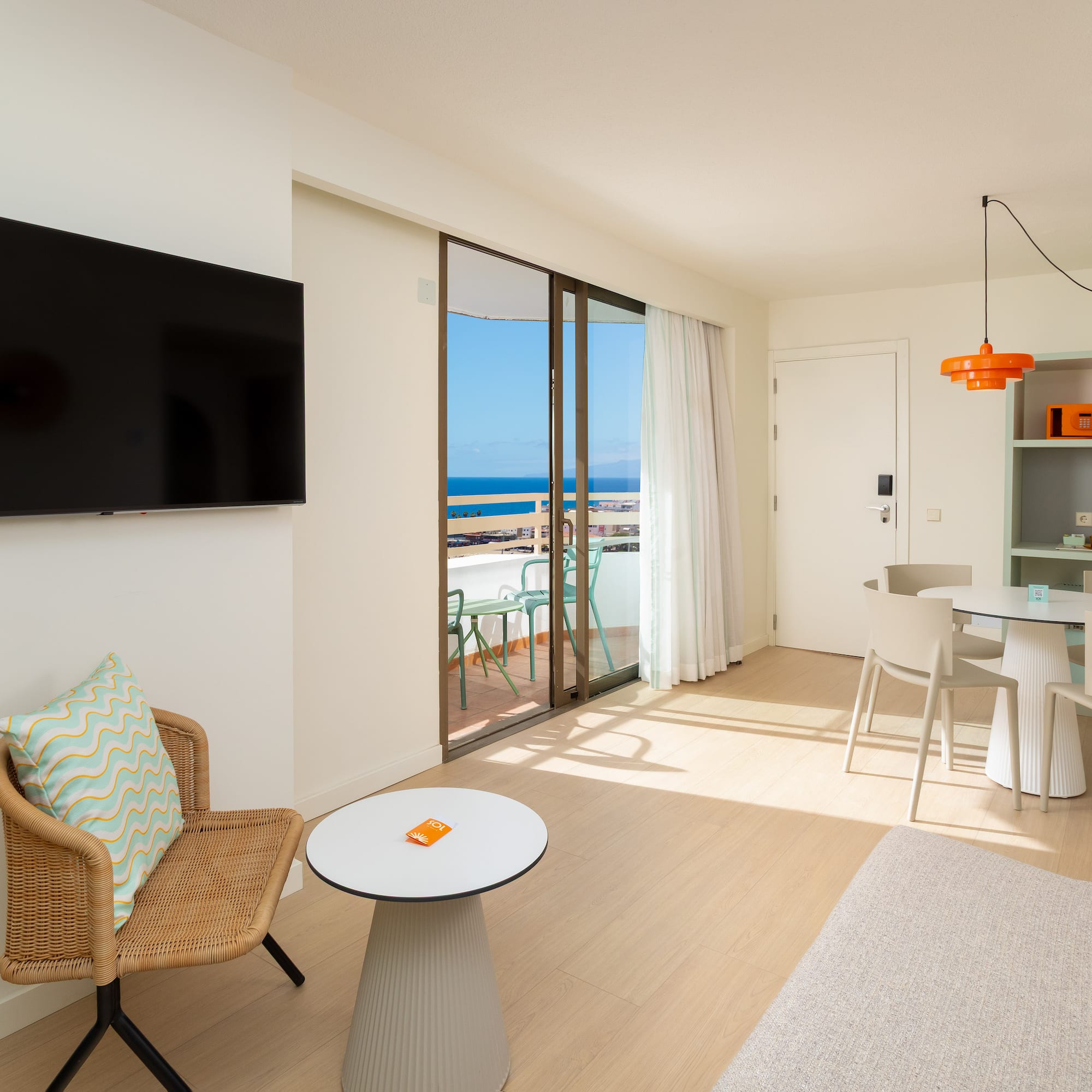 a living room with a television and a table