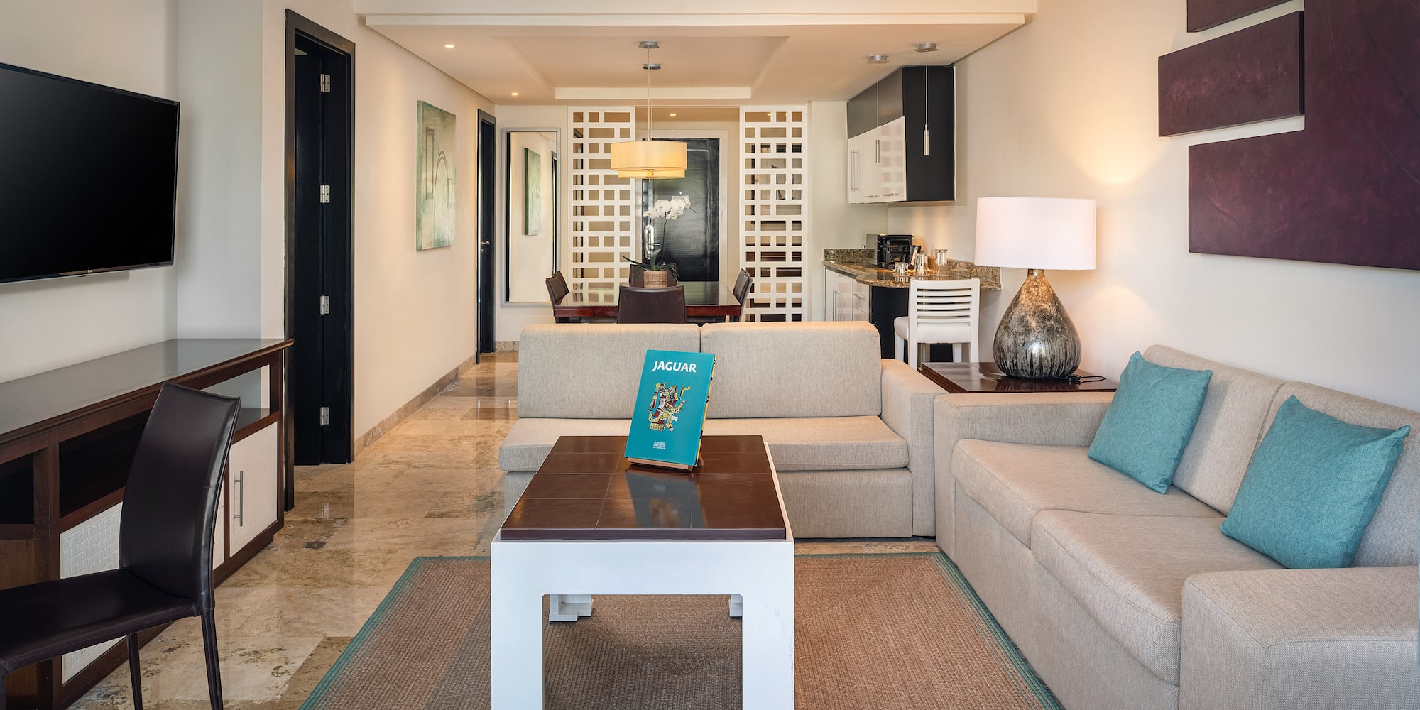 a living room with a couch and a table