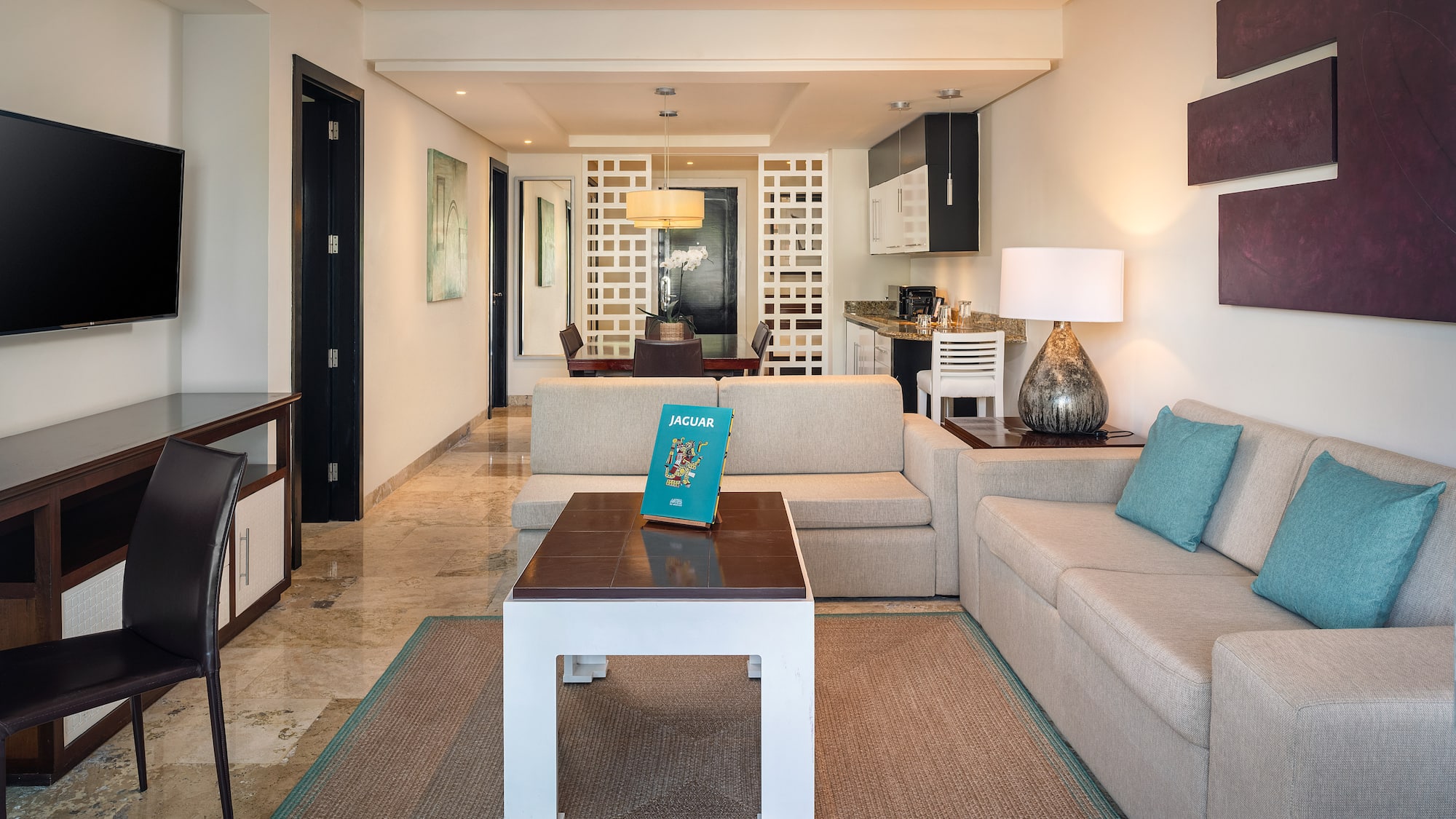 a living room with a couch and a table