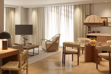 a living room with a television and a table