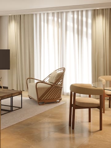 a living room with a television and a table