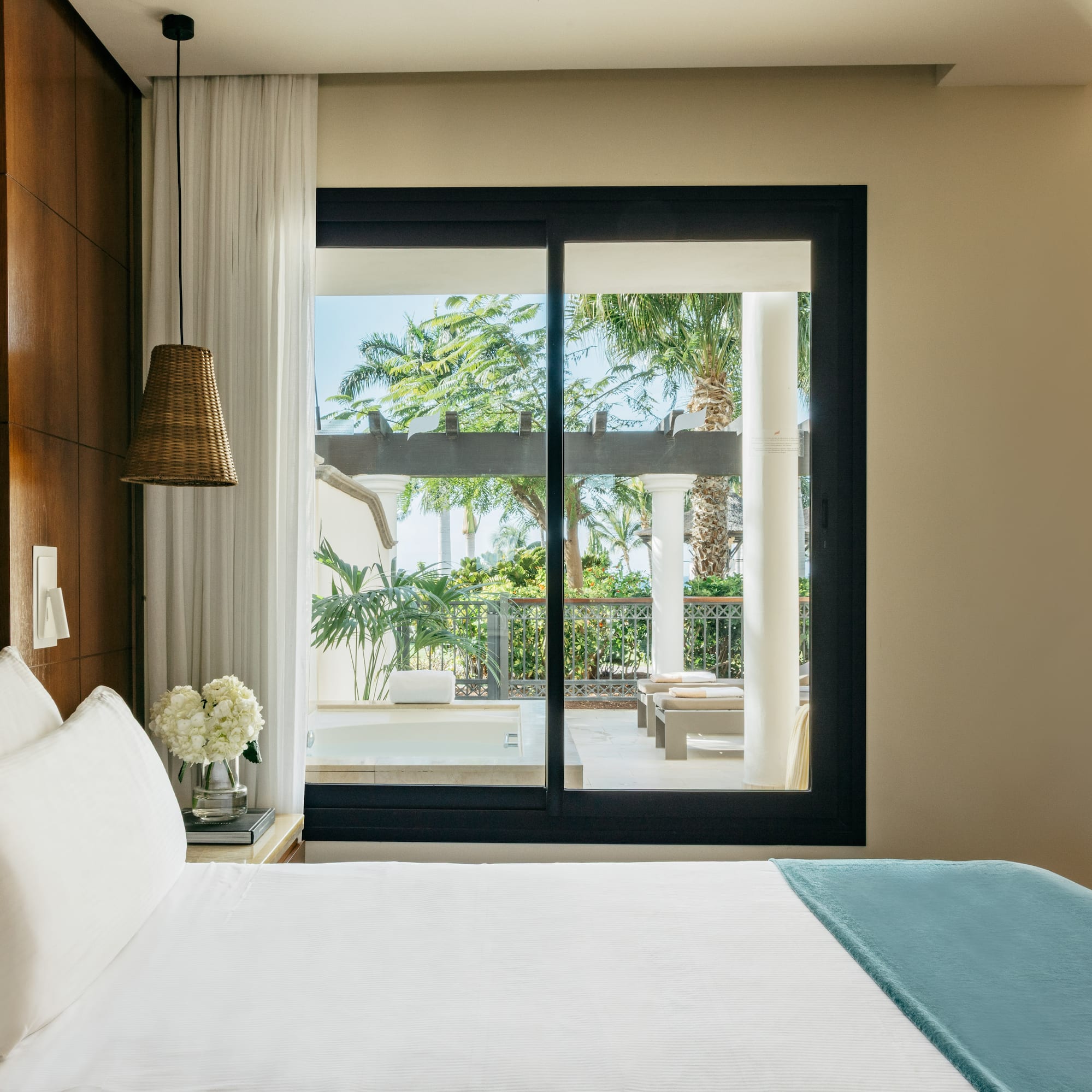 a bed with a glass door