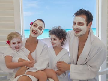 a group of people with white facial masks