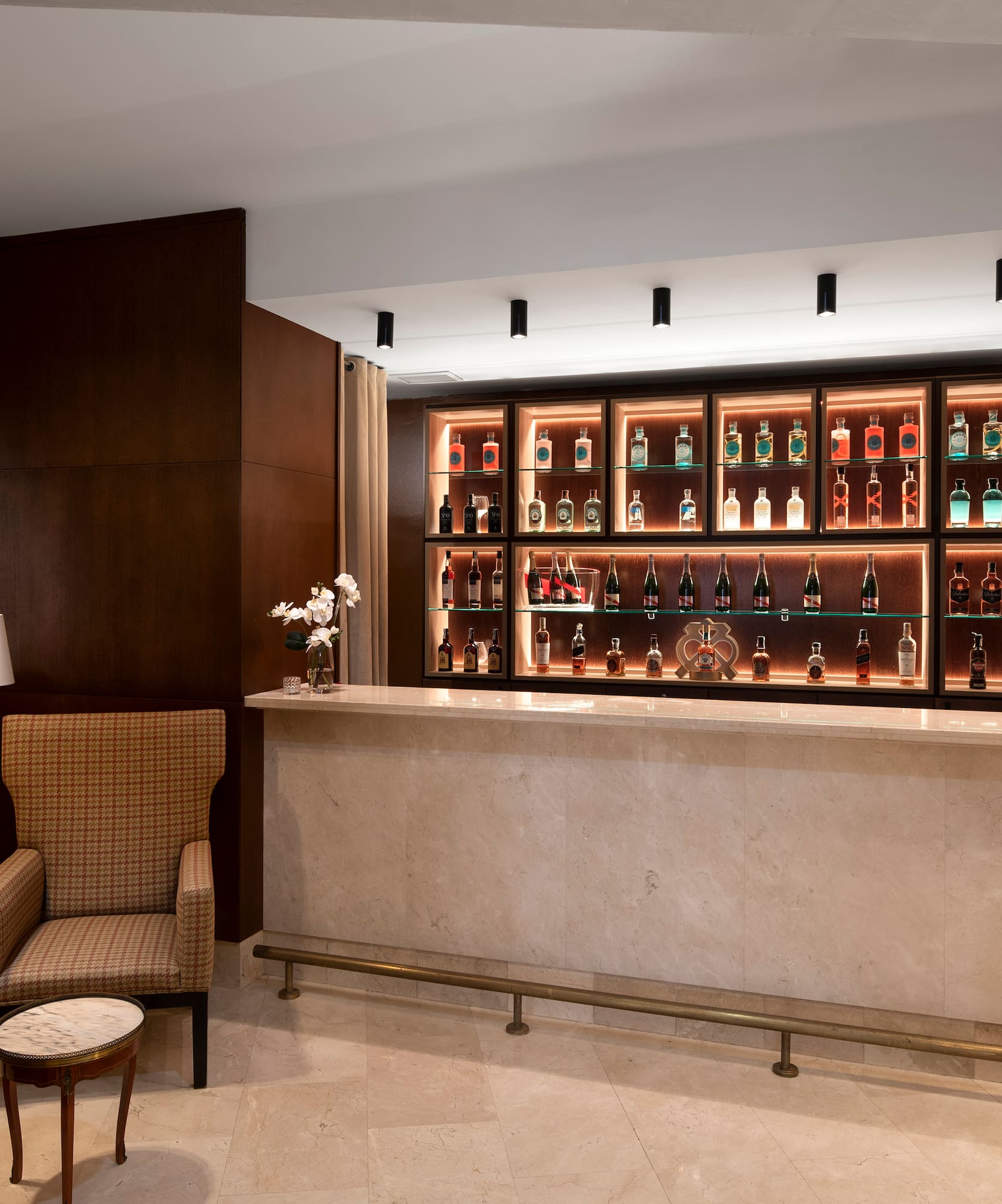 a bar with shelves of liquor bottles