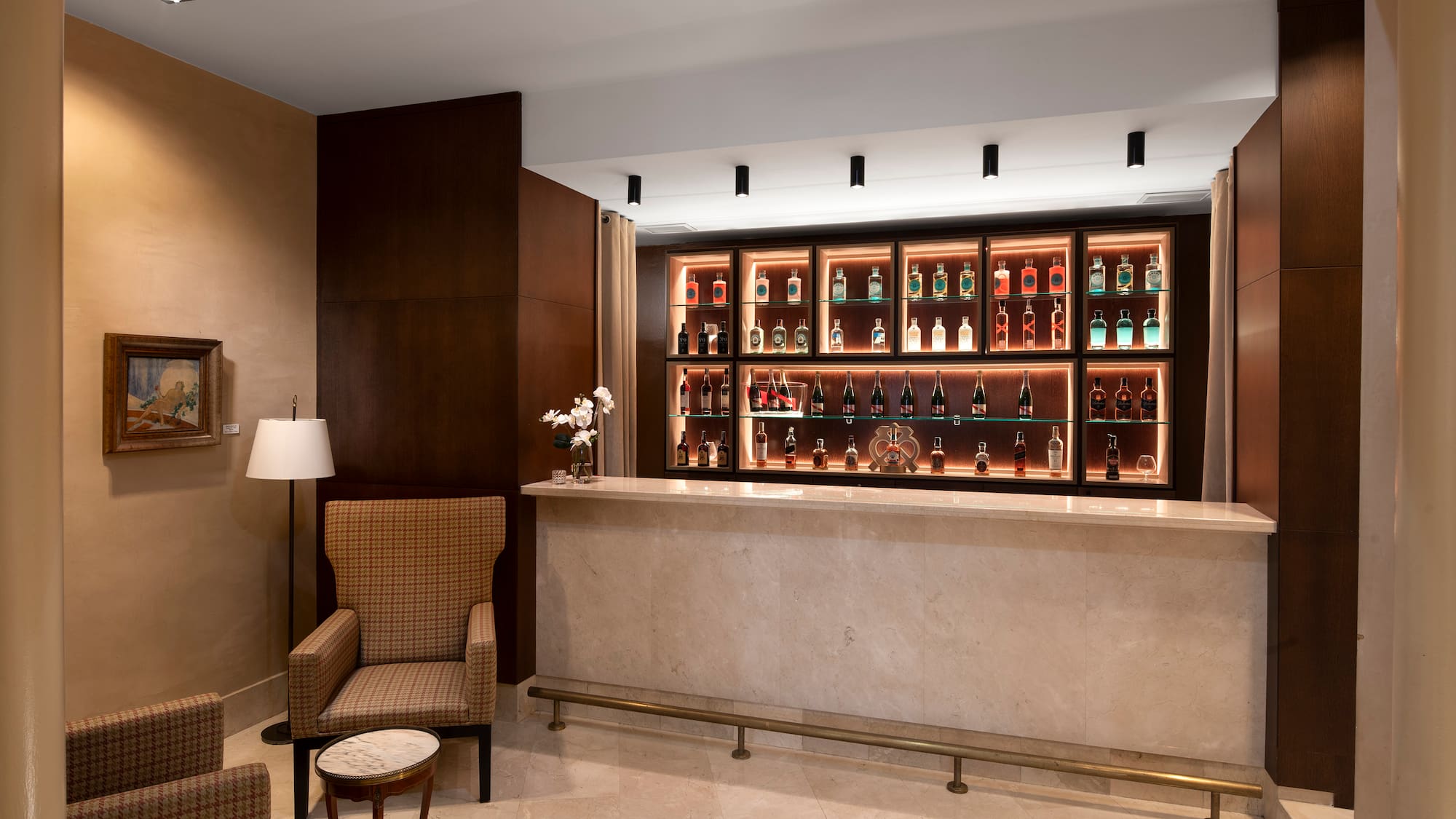 a bar with shelves of liquor bottles