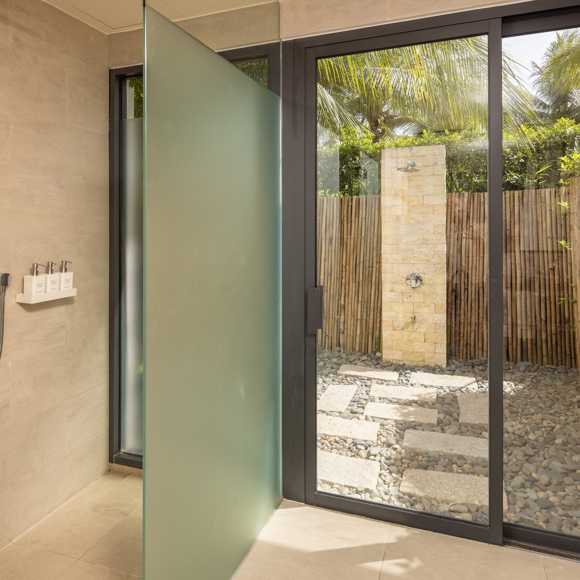 a glass shower door in a bathroom