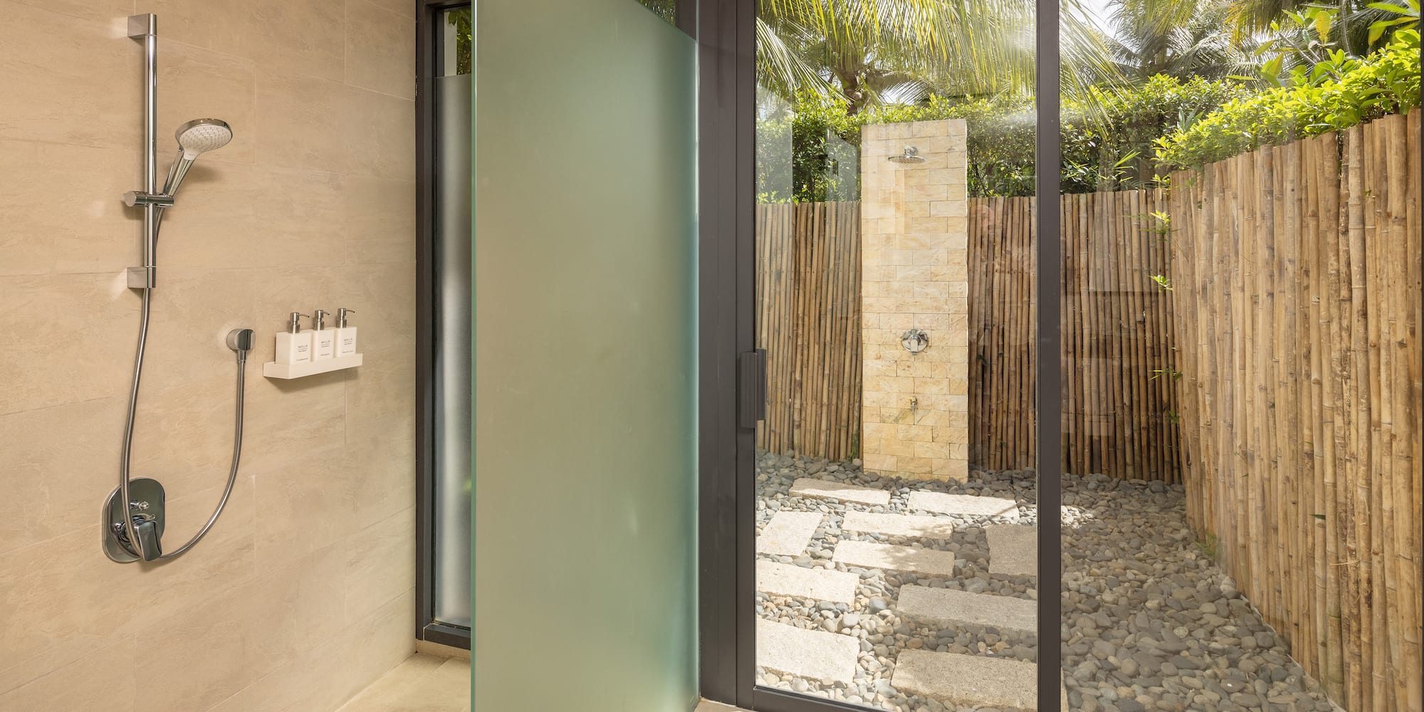 a glass shower door in a bathroom