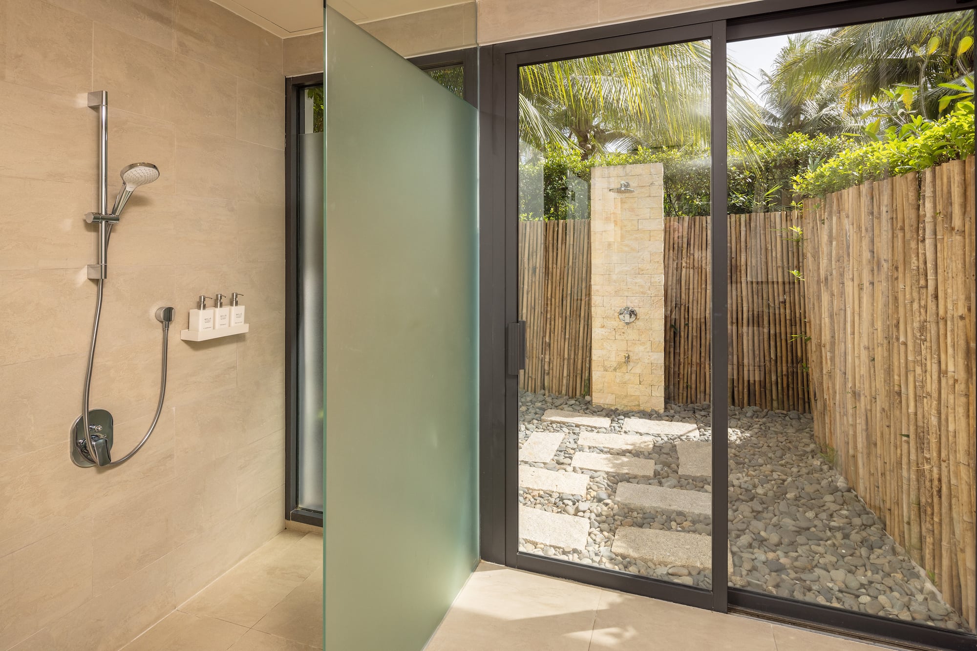 a glass shower door in a bathroom