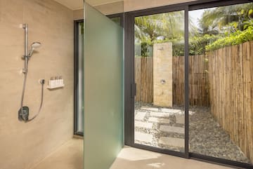 a glass shower door in a bathroom