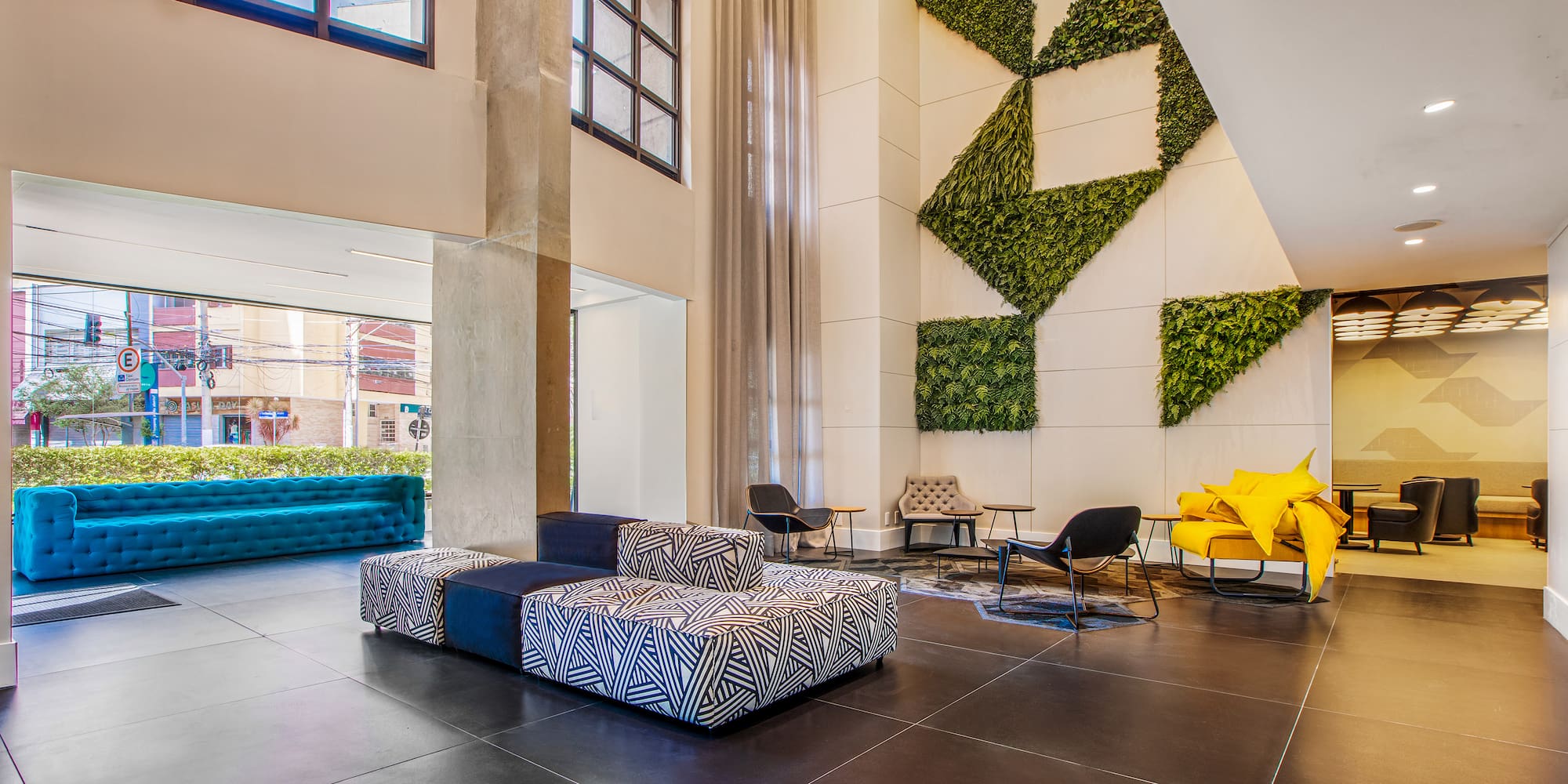 a room with a large wall and chairs