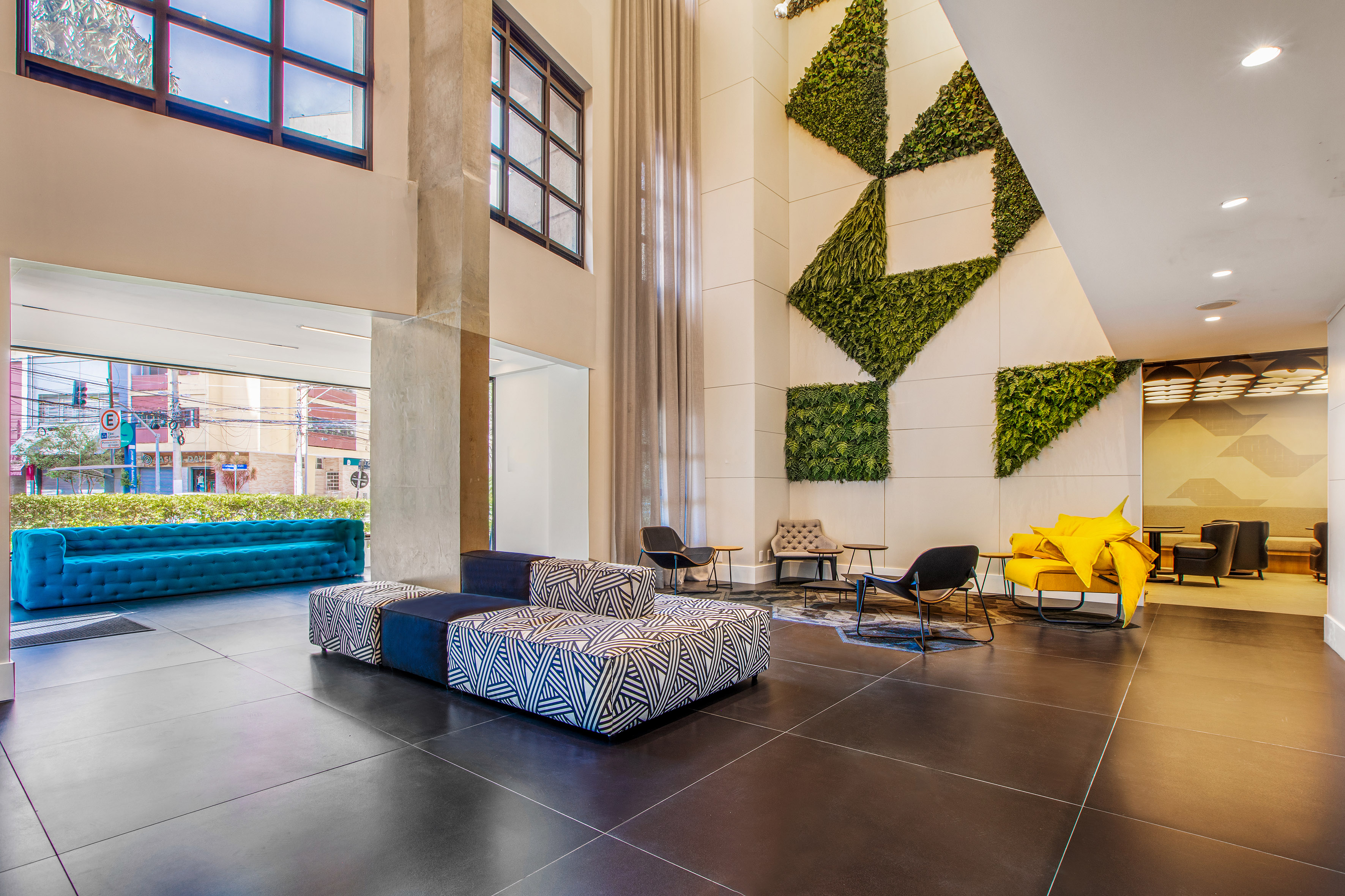 a room with a large wall and chairs