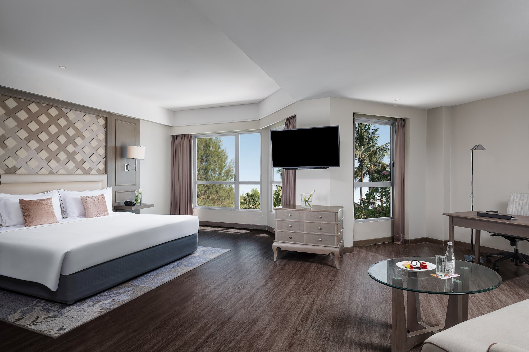 a room with a bed and a television