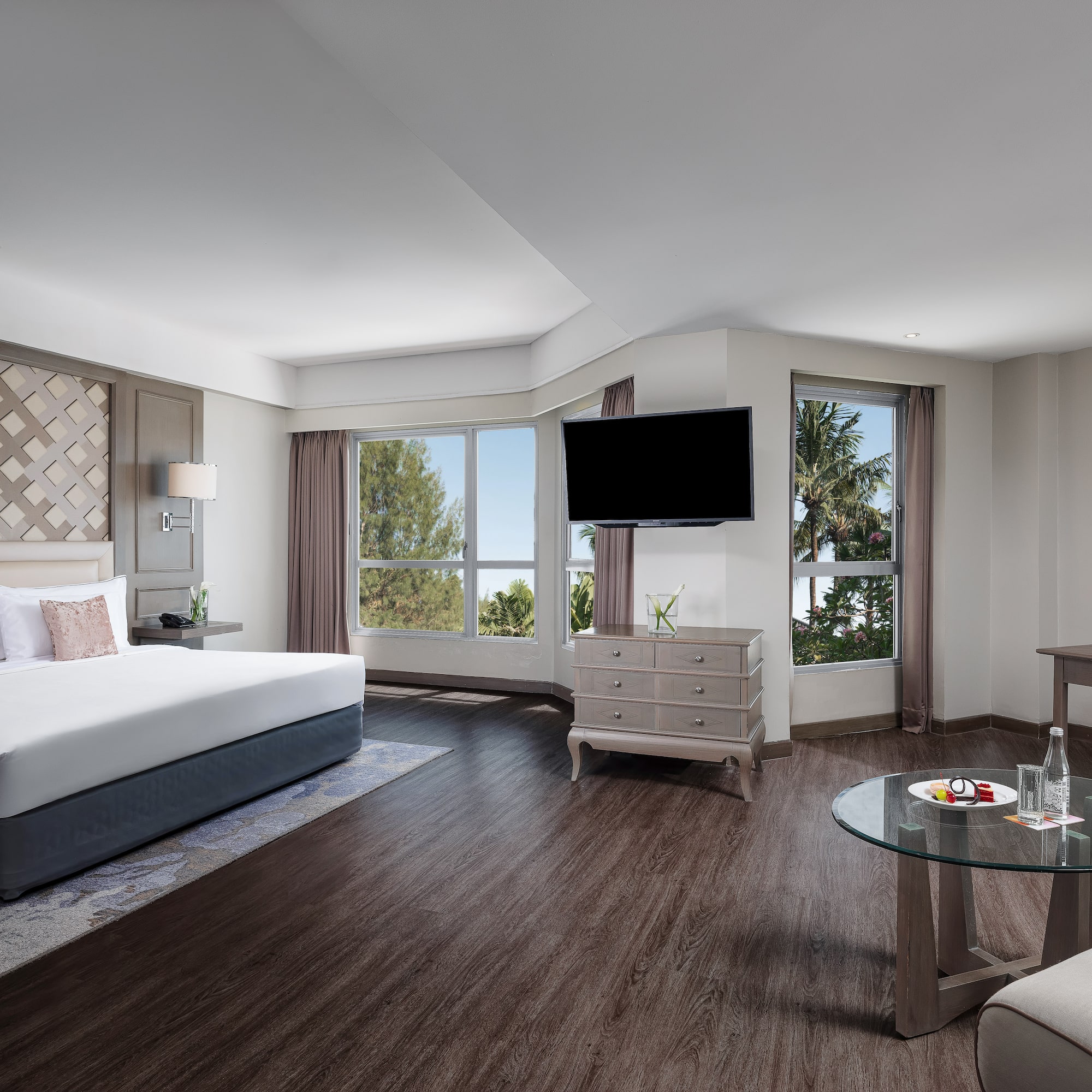 a room with a bed and a television