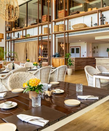 a restaurant with tables and chairs