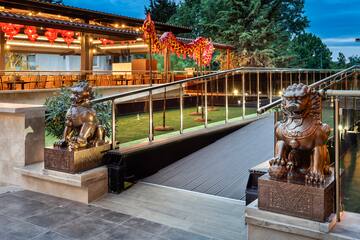 a building with a staircase and statues of lions