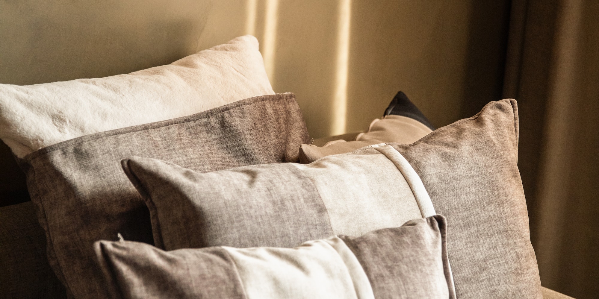 a group of pillows on a couch