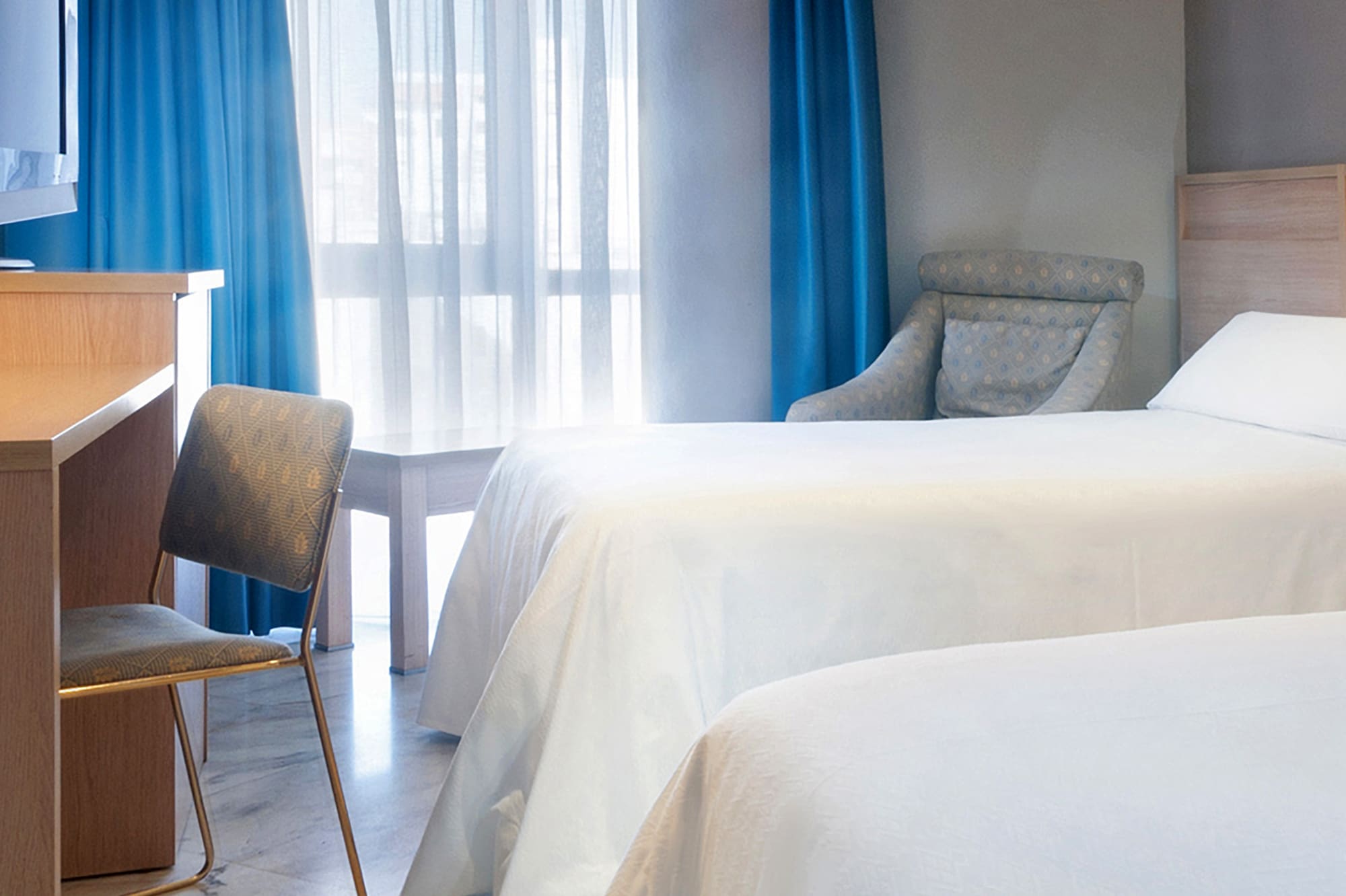 two beds in a hotel room