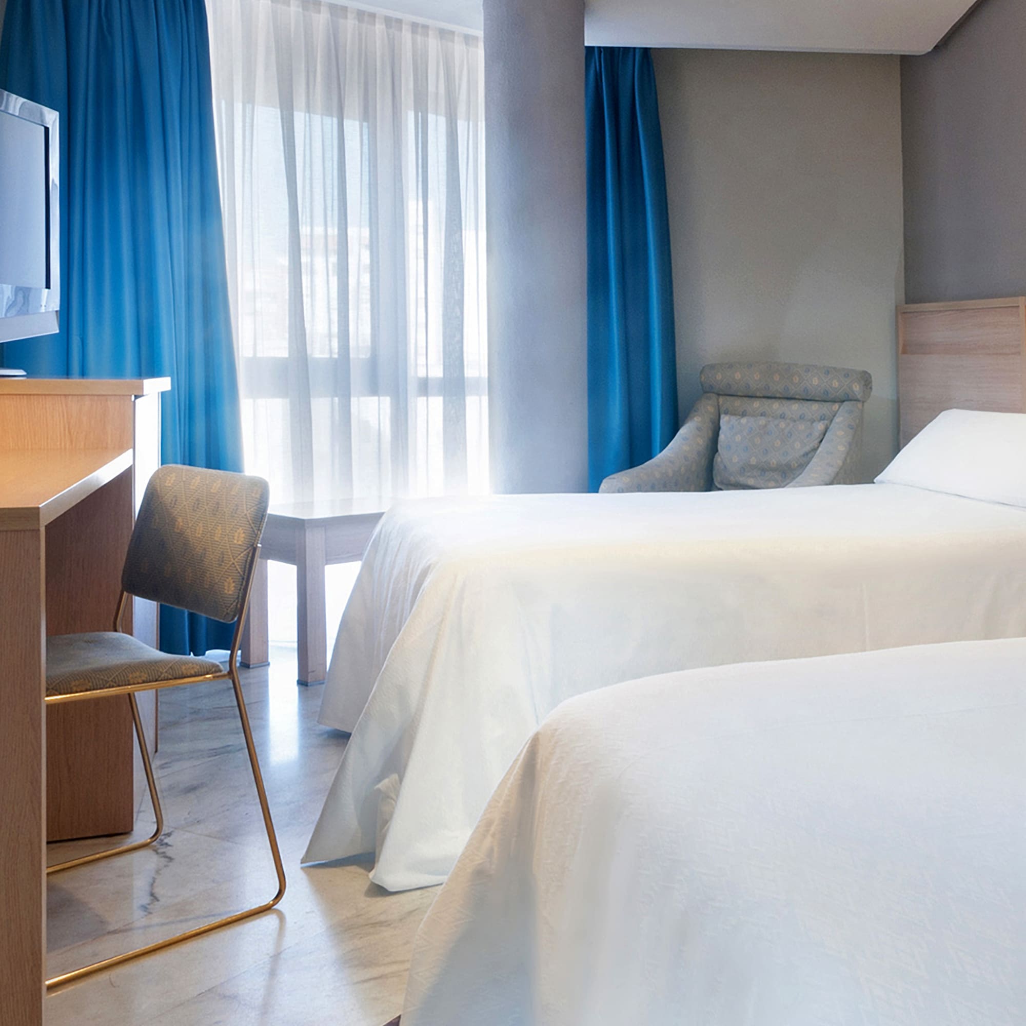 two beds in a hotel room