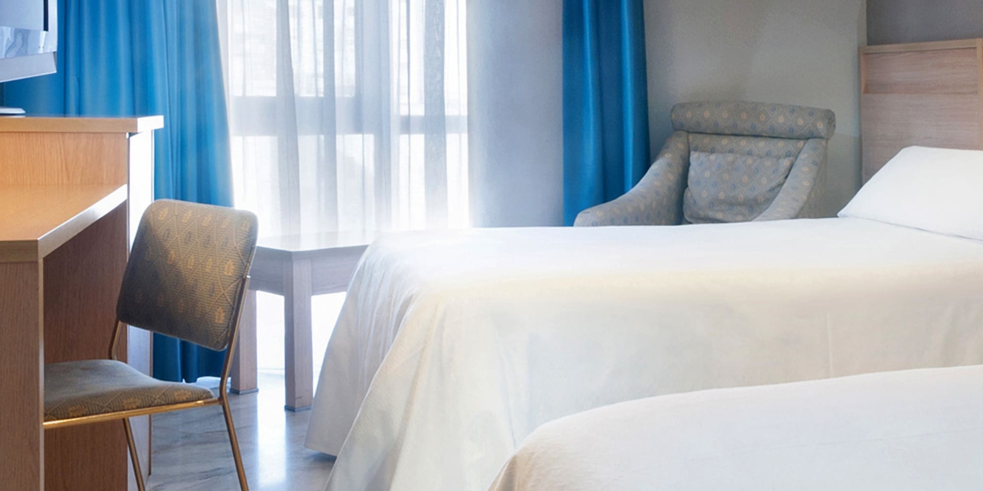 two beds in a hotel room