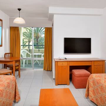 a room with a television and table