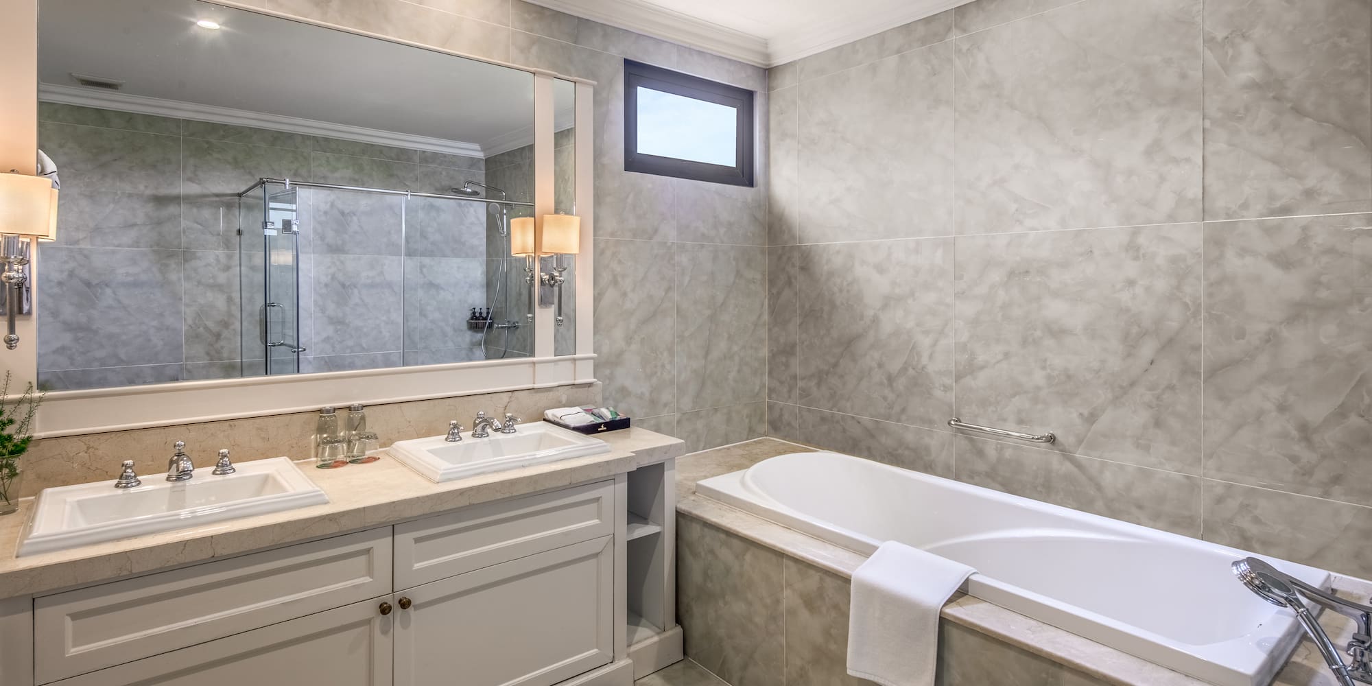 a bathroom with a tub and sink