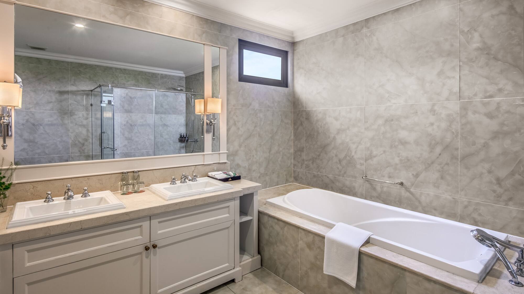 a bathroom with a tub and sink