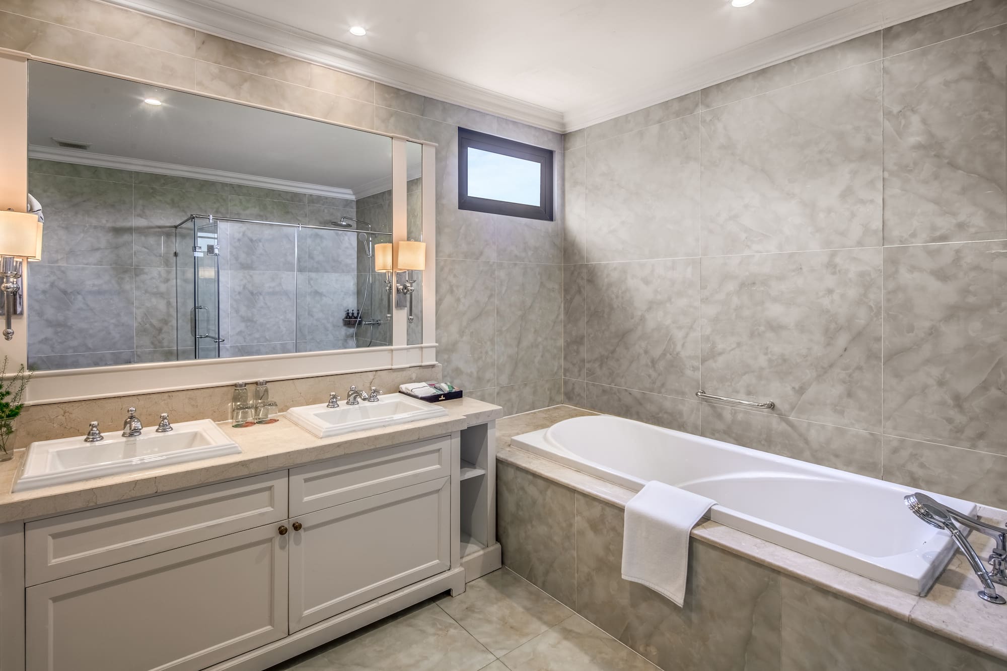 a bathroom with a tub and sink