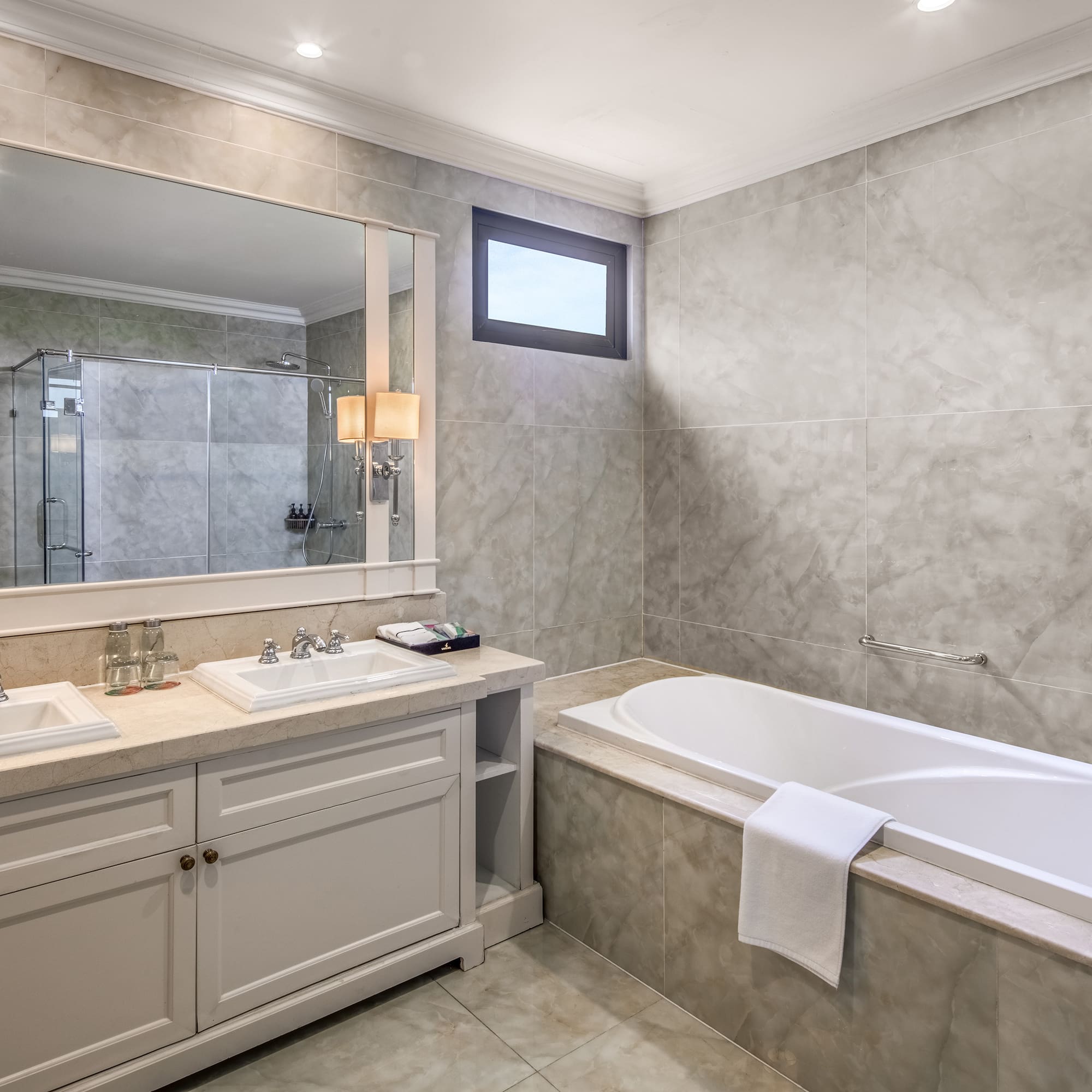 a bathroom with a tub and sink