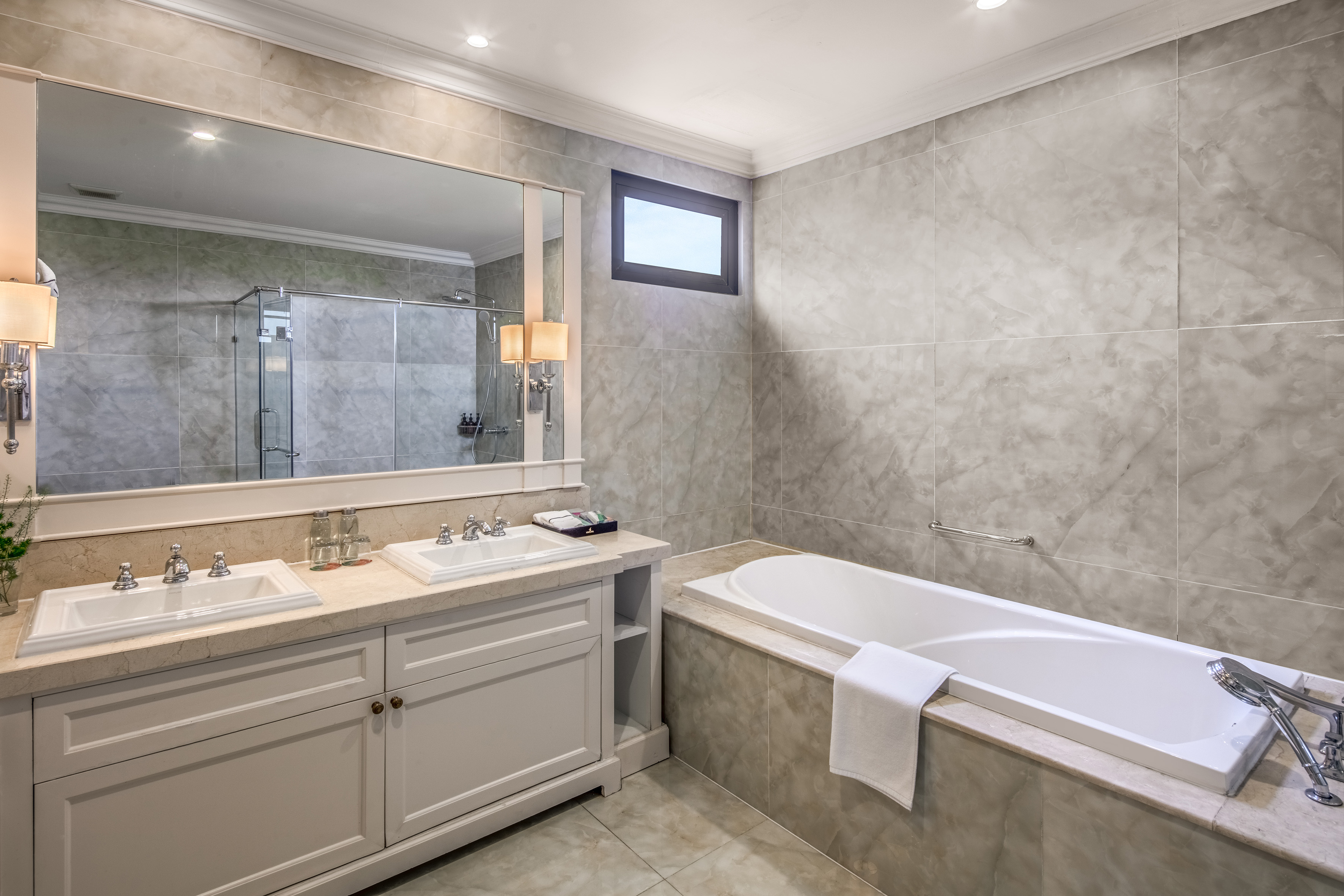a bathroom with a tub and sink