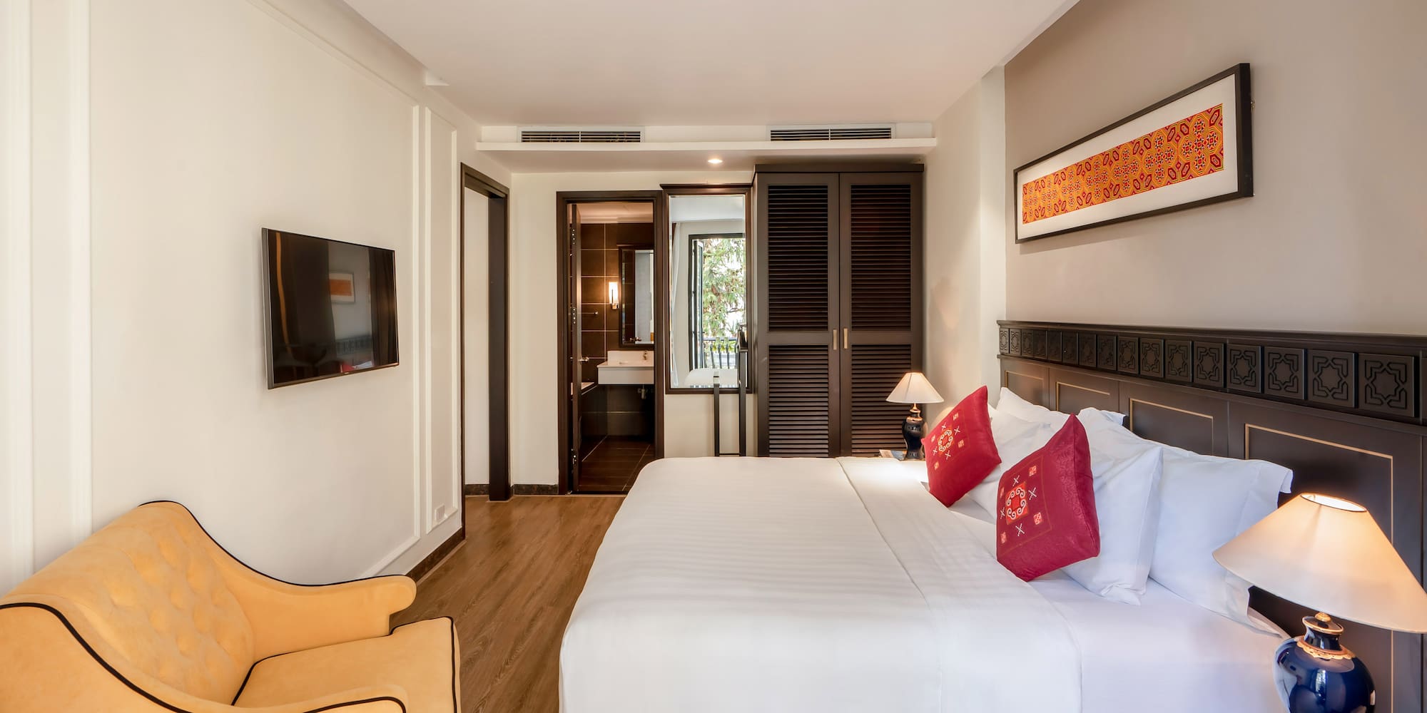 a bedroom with a bed and a chair