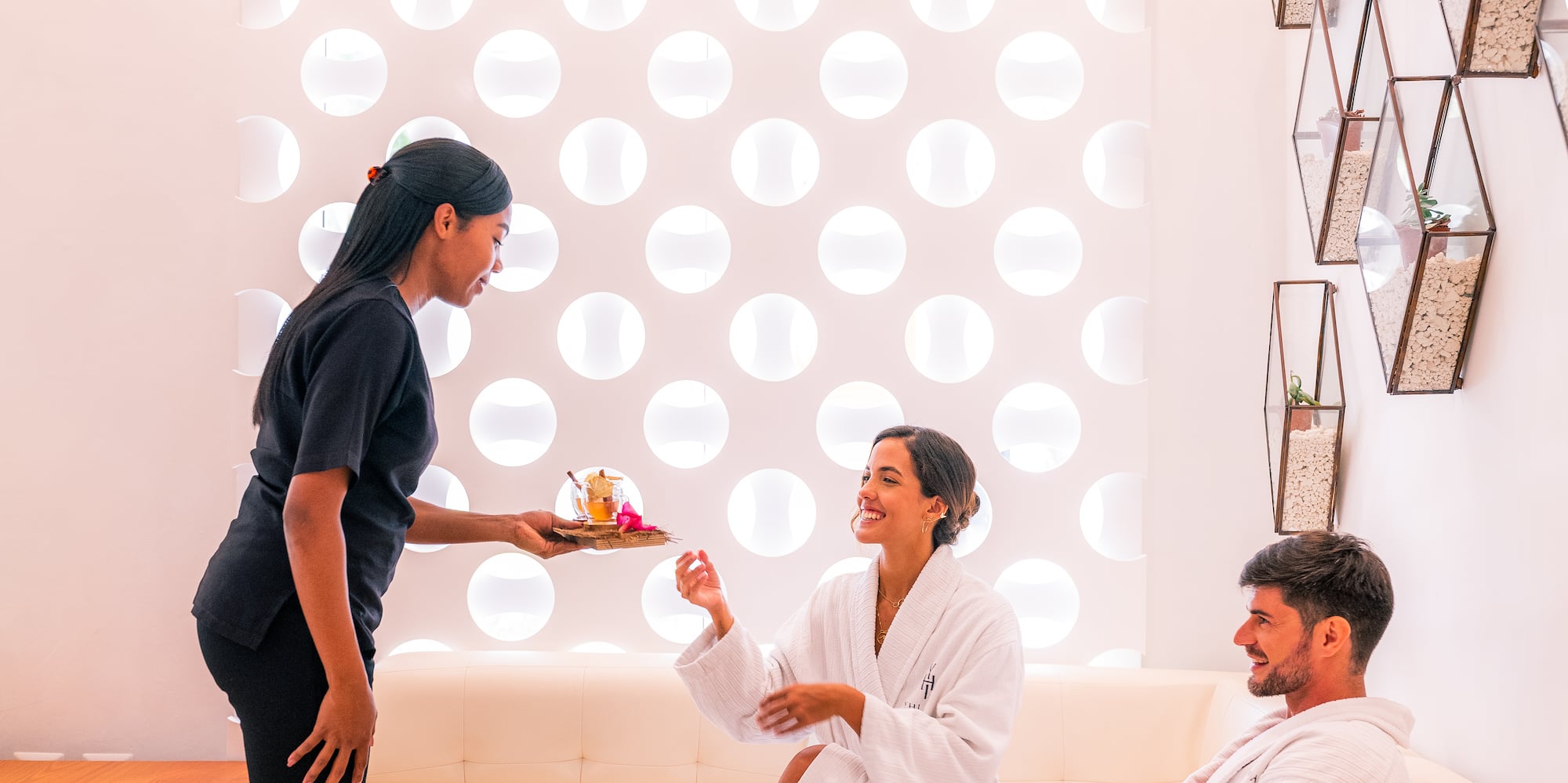 a woman giving a tray to a man