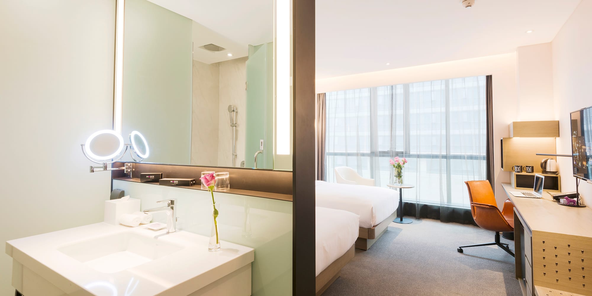 a room with a large mirror and a bed