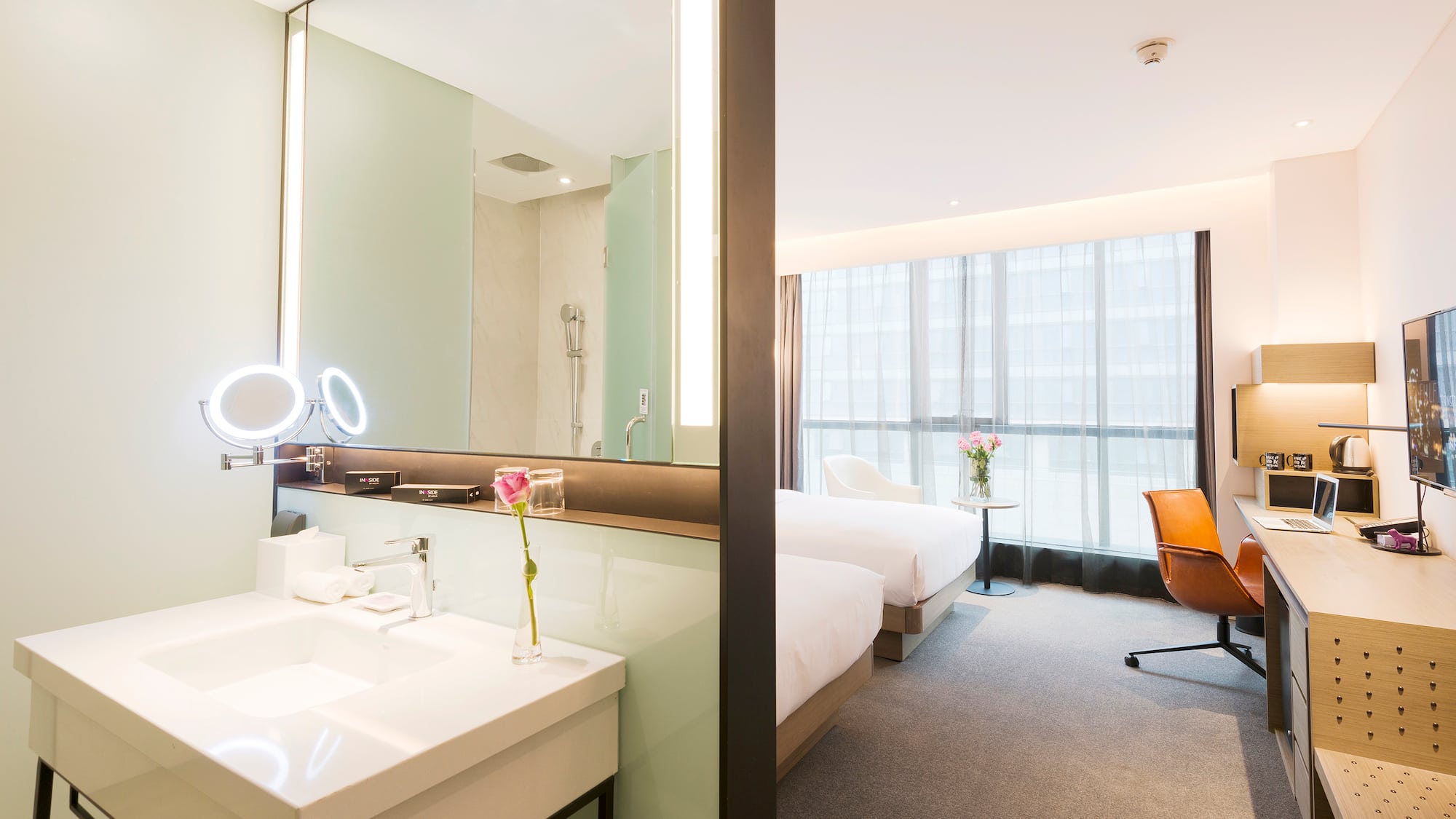 a room with a large mirror and a bed