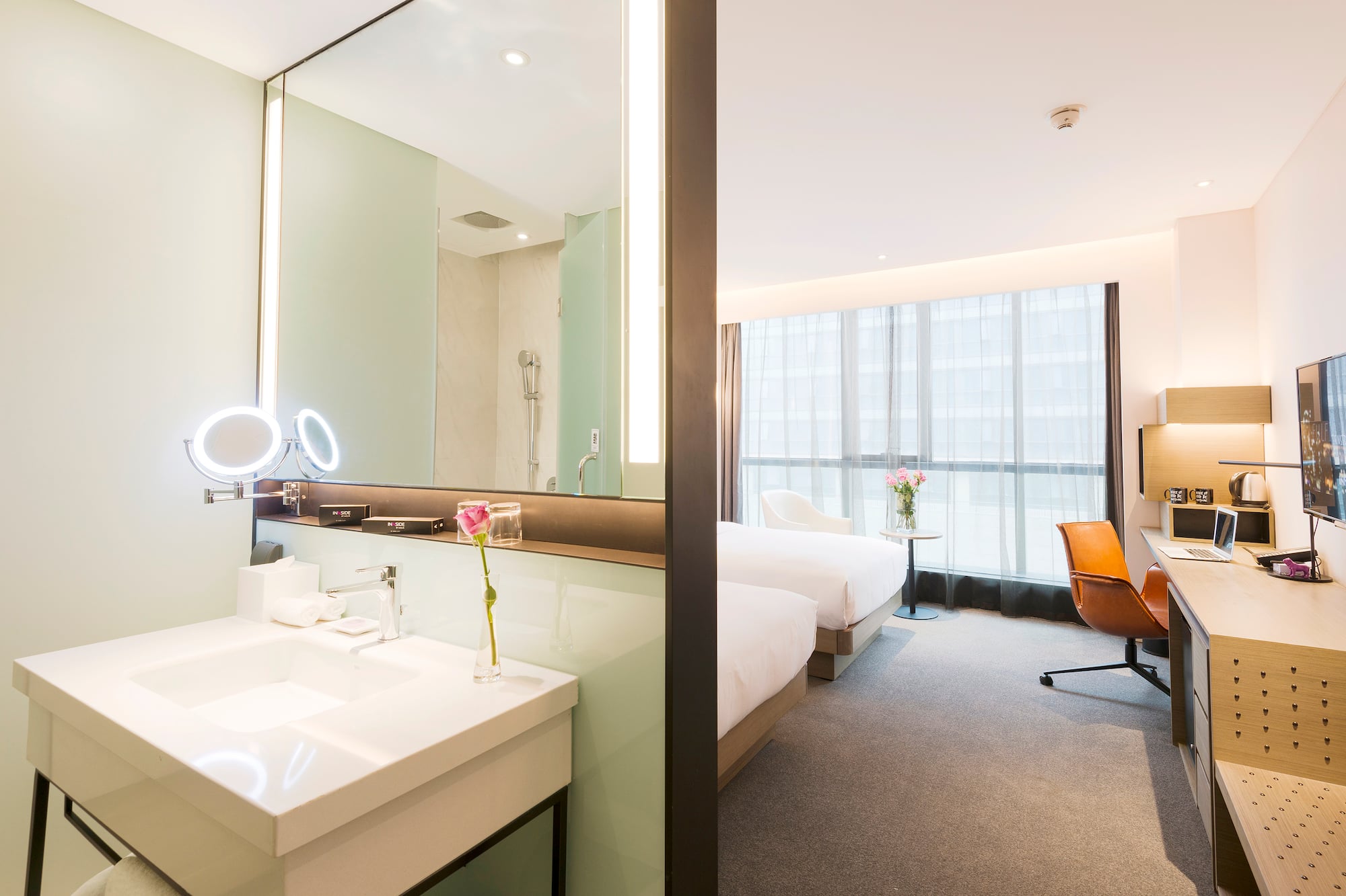 a room with a large mirror and a bed