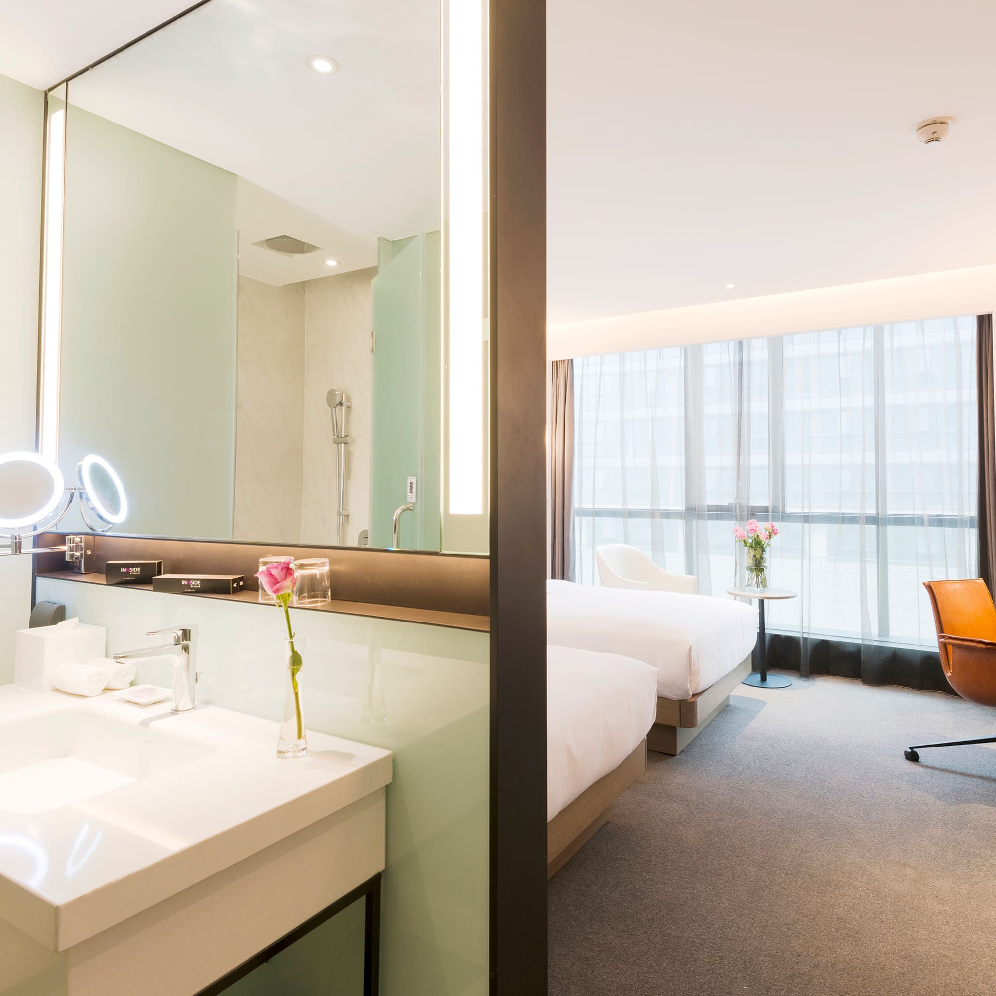 a room with a large mirror and a bed